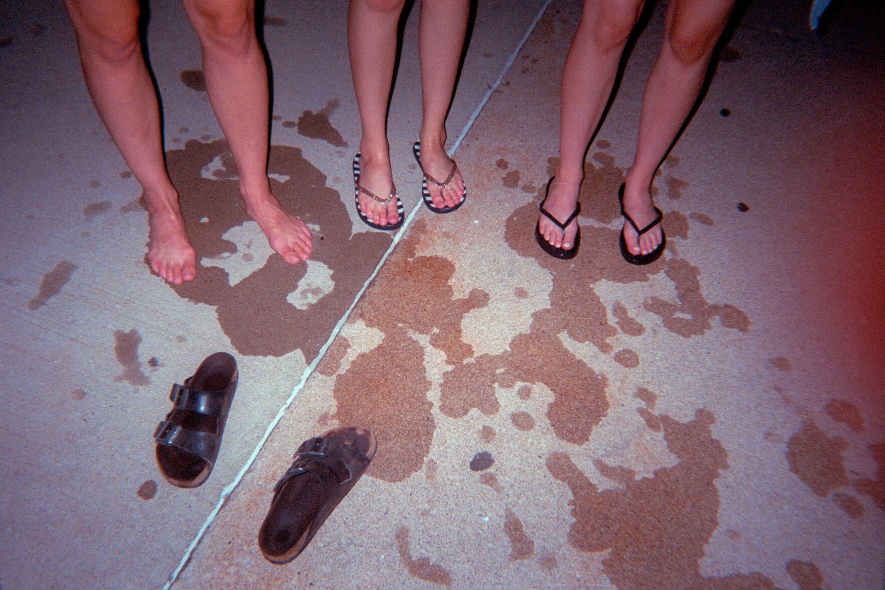 From left, Liz Cahalan, Cat Chew and Merci Russell dry off after jumping in the fountain